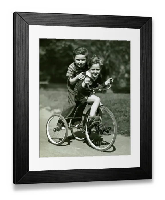 Framed Print : Young boy and girl on bike Framed Print : Young boy and girl on bike