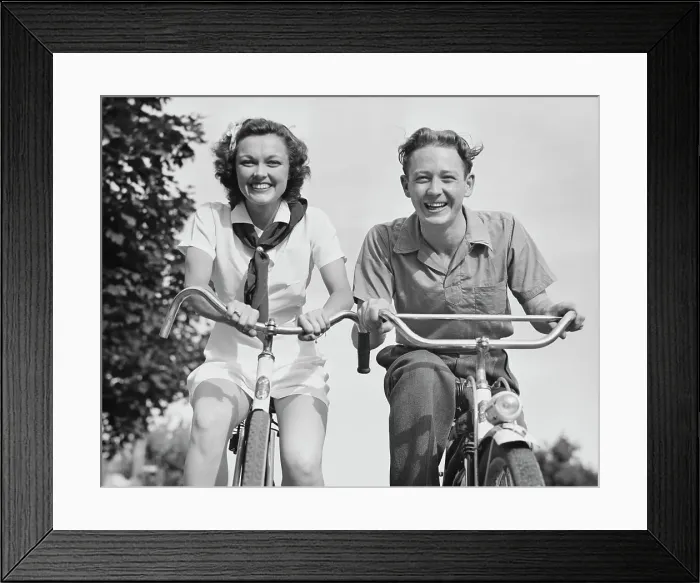 Framed Print : Young Couple On Bikes Framed Print : Young Couple On Bikes