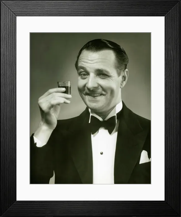 Framed Print : Man holding shot of alcohol Framed Print : Man holding shot of alcohol