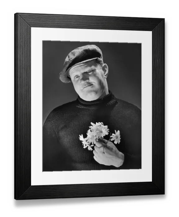 Framed Print : A burly man holding a posy of flowers, circa 1955 Framed Print : A burly man holding a posy of flowers, circa 1955