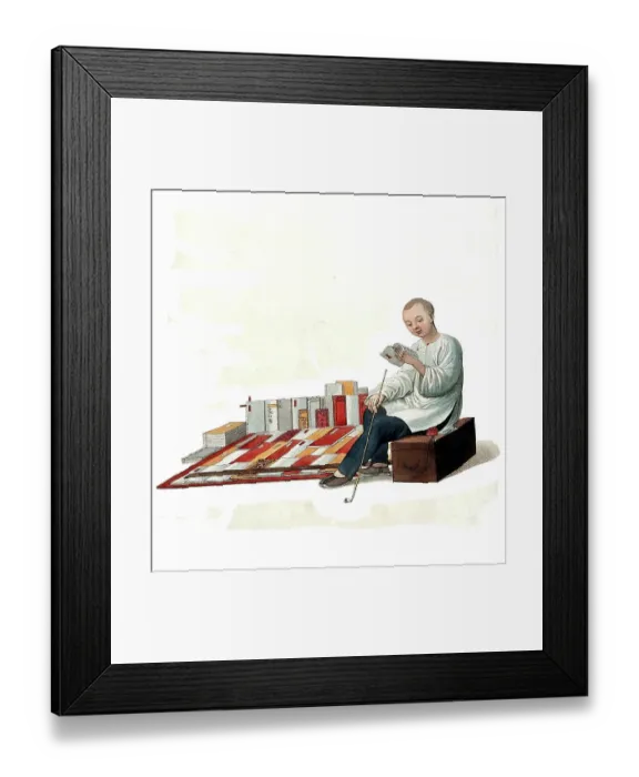 Framed Print : A Chinese bookseller sitting on a box in the street reading in front of his books, c. 1810, China, Historical, digitally restored reproduction from a 19th century original Framed Print : A Chinese bookseller sitting on a box in the street reading in front of his books, c. 1810, China, Historical, digitally restored reproduction from a 19th century original