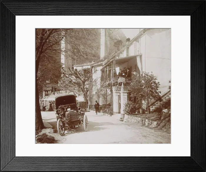 Framed Print : History of the Automobile, street view with car in Pont du Loup, on the right a party near a hotel, 1903, France, digitally restored reproduction from a 19th-20th century original Framed Print : History of the Automobile, street view with car in Pont du Loup, on the right a party near a hotel, 1903, France, digitally restored reproduction from a 19th-20th century original