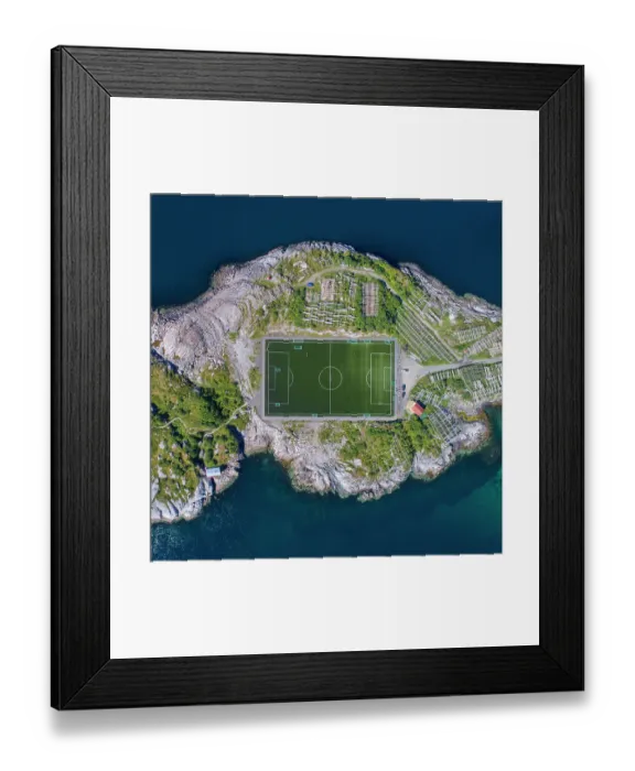 Framed Print : Football field in Henningsvaer from above. Henningsvaer is a fishing village located on several small islands in the Lofoten archipelago in Norway Framed Print : Football field in Henningsvaer from above. Henningsvaer is a fishing village located on several small islands in the Lofoten archipelago in Norway