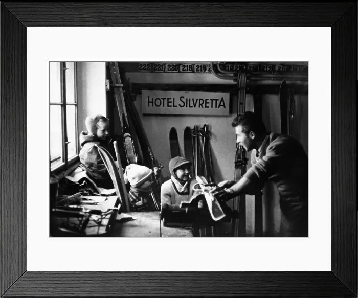 Framed Print : Ski Craft. 12th February 1955: Children watch a man working on skiis in a hotel workshop Framed Print : Ski Craft. 12th February 1955: Children watch a man working on skiis in a hotel workshop