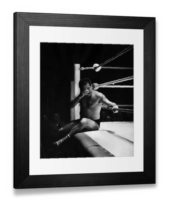Framed Print : Thrown. December 1954: Wrestler Milo Popocopolis sits outside the ring Framed Print : Thrown. December 1954: Wrestler Milo Popocopolis sits outside the ring