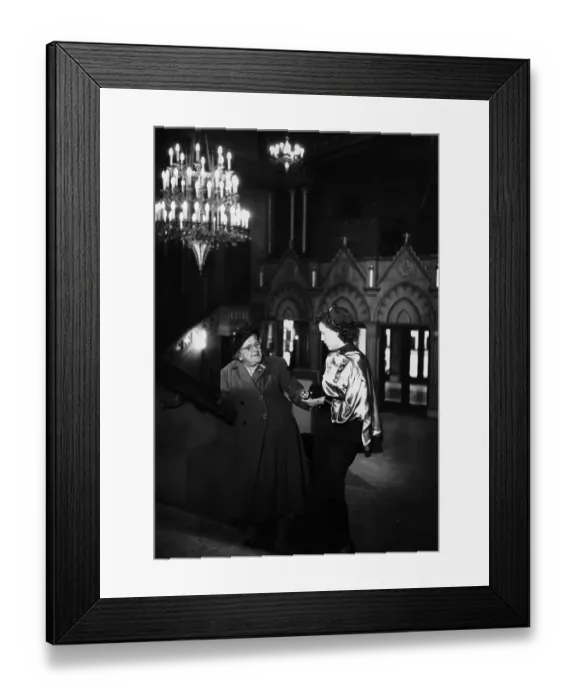 Framed Print : Usherette. circa 1954: An usherette in the cinema examines tickets Framed Print : Usherette. circa 1954: An usherette in the cinema examines tickets