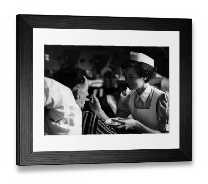 Framed Print : Feeding The Patient Framed Print : Feeding The Patient