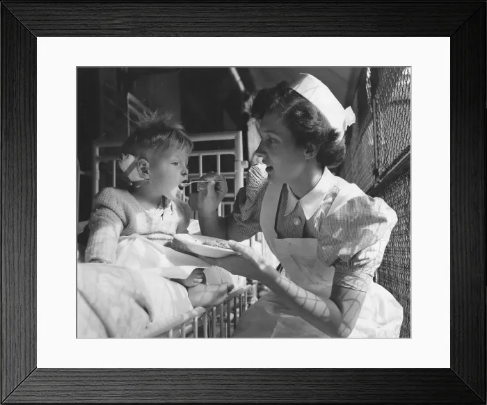 Framed Print : Nurse Feeds Patient Framed Print : Nurse Feeds Patient