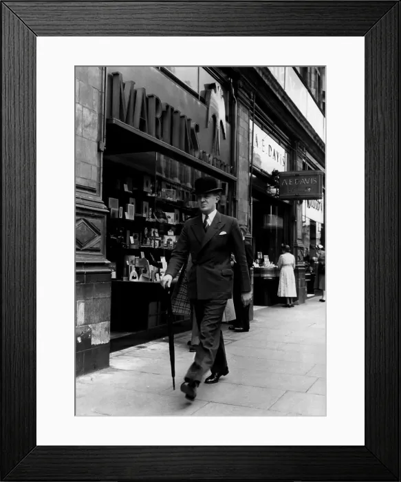 Framed Print : City Gent. A businessman in a bowler hat walking down London's Piccadilly Framed Print : City Gent. A businessman in a bowler hat walking down London's Piccadilly