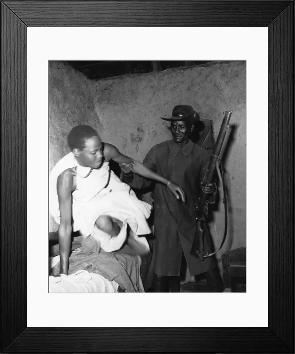 Framed Print : Get Out !. A woman Mau Mau suspect being hauled out of bed by a member Framed Print : Get Out !. A woman Mau Mau suspect being hauled out of bed by a member