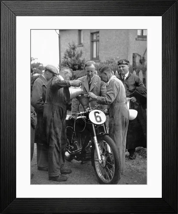 Framed Print : TT Races. 9th June 1950: Checking and refuelling one of the motorbikes Framed Print : TT Races. 9th June 1950: Checking and refuelling one of the motorbikes