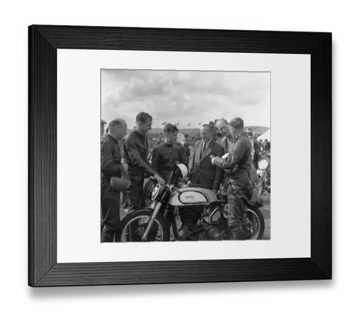 Framed Print : T T Races. 9th June 1950: Geoff Duke with his Norton No 57 talking to his Framed Print : T T Races. 9th June 1950: Geoff Duke with his Norton No 57 talking to his