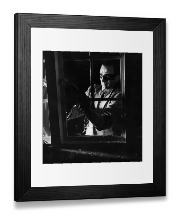 Framed Print : Break-In. 20th May 1950: A man dressed as a burglar breaking into a house via a window Framed Print : Break-In. 20th May 1950: A man dressed as a burglar breaking into a house via a window