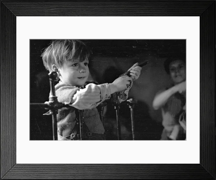 Framed Print : Happy Boy. 29th January 1949: A child playing with a gun in his home in the New Forest Framed Print : Happy Boy. 29th January 1949: A child playing with a gun in his home in the New Forest