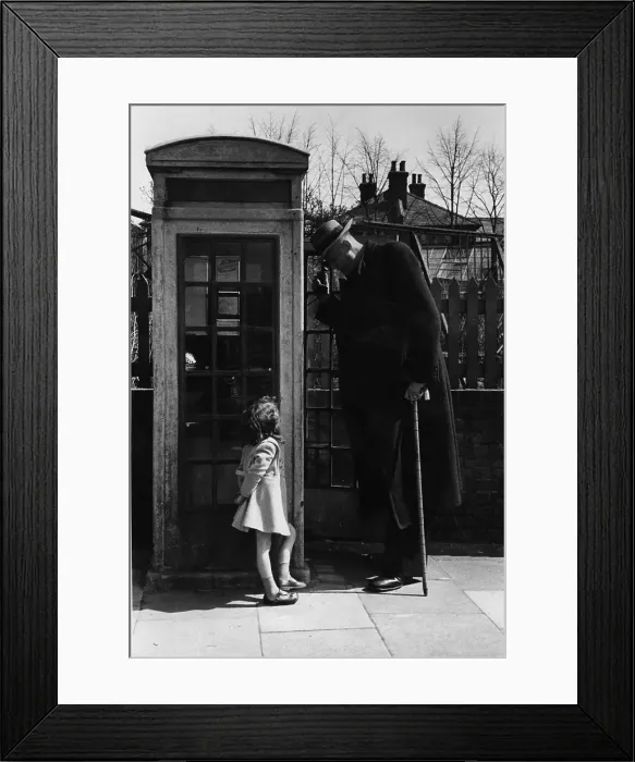 Framed Print : Phoning Giant Framed Print : Phoning Giant