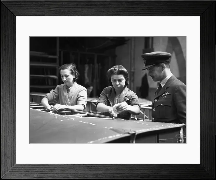 Framed Print : War Work. July 1942: A Royal Air Force pilot visits an aircraft factory Framed Print : War Work. July 1942: A Royal Air Force pilot visits an aircraft factory