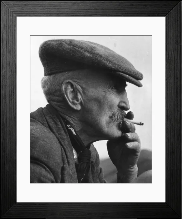 Framed Print : Farmer. 29th November 1941: A farmer enjoying a smoke as he watches a hunt