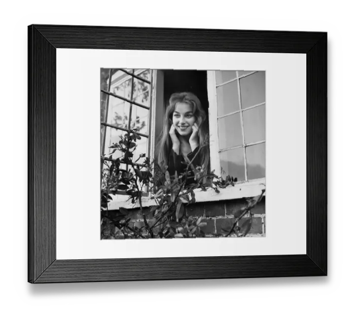 Framed Print : Repunzel. 1957: A model looking out of an open window Framed Print : Repunzel. 1957: A model looking out of an open window