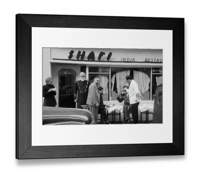Framed Print : The Shafi. A Sikh doorman (left) outside the Shafi Indian restaurant in Gerard Street