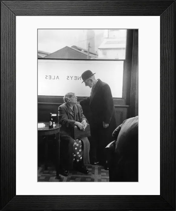 Framed Print : Pub Scene. An old couple talking and drinking in an English pub Framed Print : Pub Scene. An old couple talking and drinking in an English pub