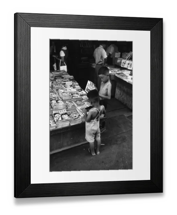 Framed Print : Good Read. 6th August 1955: Two little boys browse at a street bookstall in Hiroshima Framed Print : Good Read. 6th August 1955: Two little boys browse at a street bookstall in Hiroshima