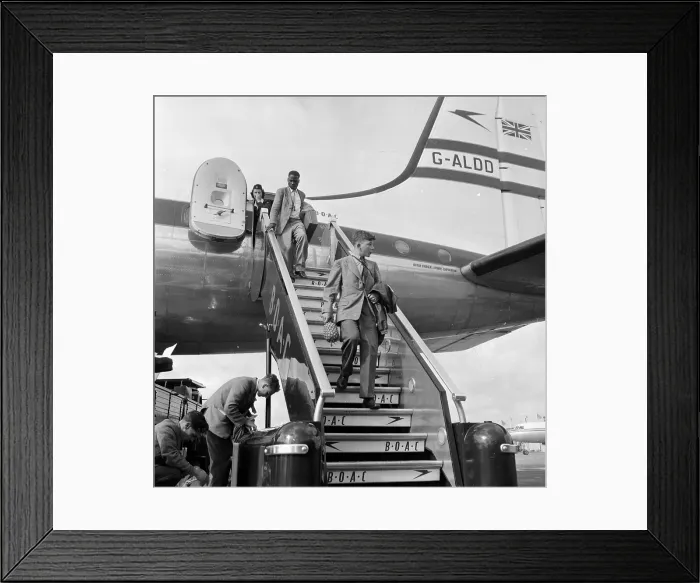 Framed Print : Home Safe. 24th October 1953: A youth disembarking Framed Print : Home Safe. 24th October 1953: A youth disembarking