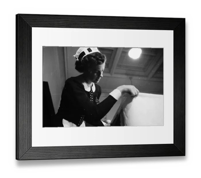 Framed Print : New Nippy. 24th January 1953: Irish born Mary Hilton adjusts a buffet cloth Framed Print : New Nippy. 24th January 1953: Irish born Mary Hilton adjusts a buffet cloth