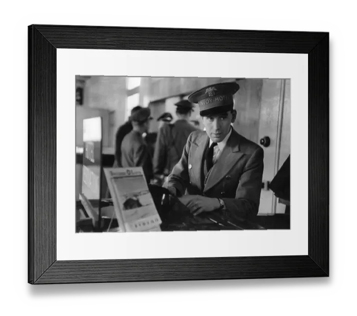 Framed Print : Savoy Rep. A representative from the Savoy Hotel waits to greet guests at London airport Framed Print : Savoy Rep. A representative from the Savoy Hotel waits to greet guests at London airport