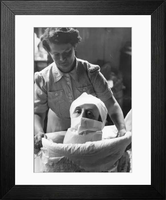 Framed Print : Wax Head. A wax head being packed up for despatch at a factory which specialises Framed Print : Wax Head. A wax head being packed up for despatch at a factory which specialises