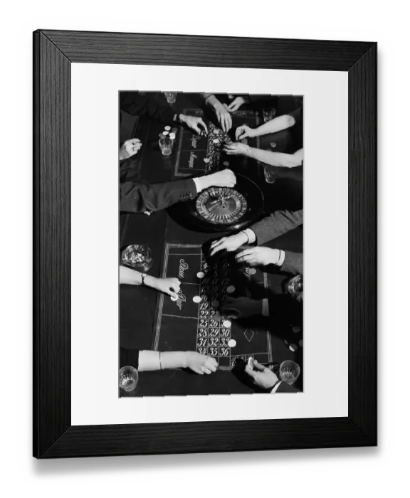 Framed Print : Roulette. People placing their bets on a roulette table Framed Print : Roulette. People placing their bets on a roulette table