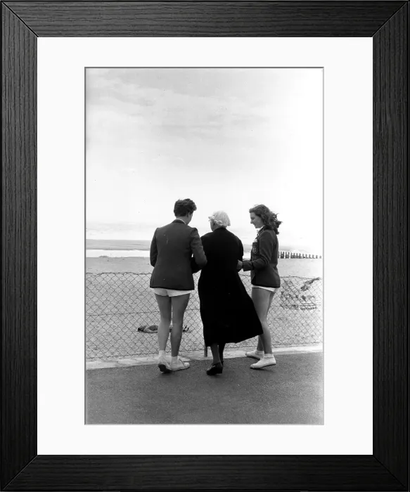Framed Print : Red Coats. 1957: Two Butlin's red coats with an elderly tourist at Skegness Framed Print : Red Coats. 1957: Two Butlin's red coats with an elderly tourist at Skegness