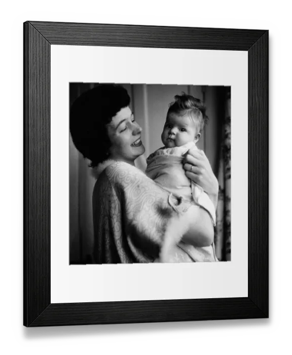Framed Print : Baby Face. circa 1957: A happy mother with her baby Framed Print : Baby Face. circa 1957: A happy mother with her baby