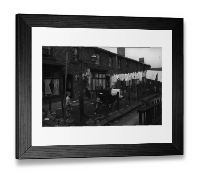 Framed Print : Backyards. 29th October 1956: Children playing in the backyards of slum area housing Framed Print : Backyards. 29th October 1956: Children playing in the backyards of slum area housing