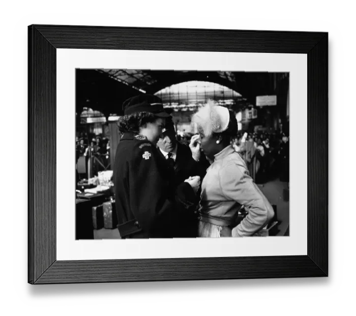 Framed Print : Got It. 27th May 1956: A Red Cross worker helps a young West Indian immigrant