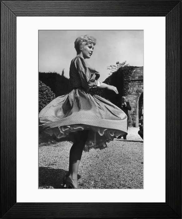 Framed Print : Kim Novak. American actress Kim Novak twirls for the camera at the Cannes Film Festival Framed Print : Kim Novak. American actress Kim Novak twirls for the camera at the Cannes Film Festival