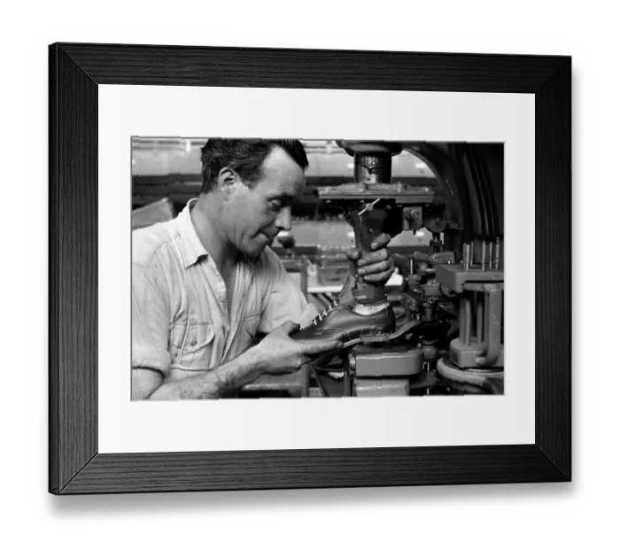 Framed Print : Shoemaker. 1st October 1955: A worker putting the finishing touches to Framed Print : Shoemaker. 1st October 1955: A worker putting the finishing touches to
