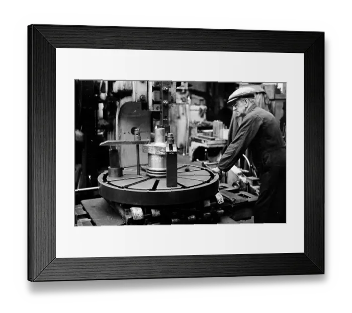 Framed Print : Big Wheel. 20th August 1955: A worker operating industrial machinery at a Glasgow factory