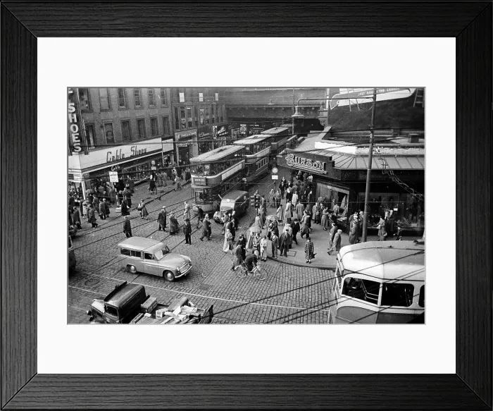 Framed Print : Tram Jam. 20th August 1955: A line of trams emerges