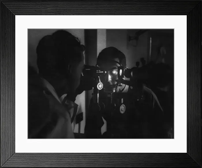 Framed Print : Eye Test. 9th July 1955: A trainee jet pilot undergoes a routine eye examination