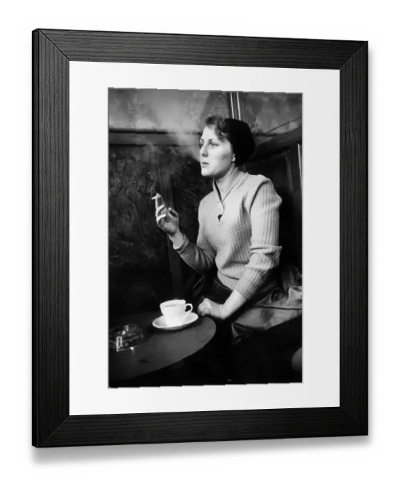 Framed Print : Smoking. 19th March 1955: A woman smoking in Newcastle Framed Print : Smoking. 19th March 1955: A woman smoking in Newcastle