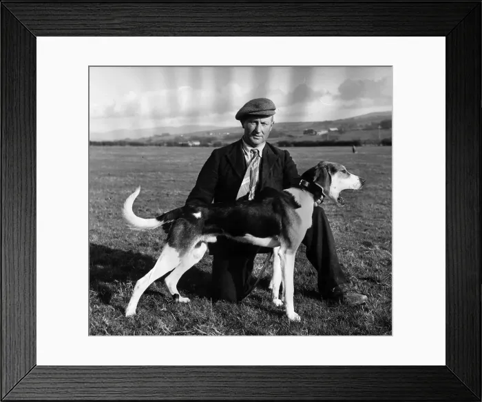 Framed Print : Bored Dog. 1955: Black Conductor a trail hound puppy with his owner J E Cassons of Brigham Framed Print : Bored Dog. 1955: Black Conductor a trail hound puppy with his owner J E Cassons of Brigham