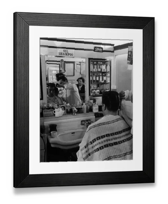 Framed Print : DA Cut. 13th November 1954: Barber Angel Rose sculpts a customer's hair into a DA style Framed Print : DA Cut. 13th November 1954: Barber Angel Rose sculpts a customer's hair into a DA style