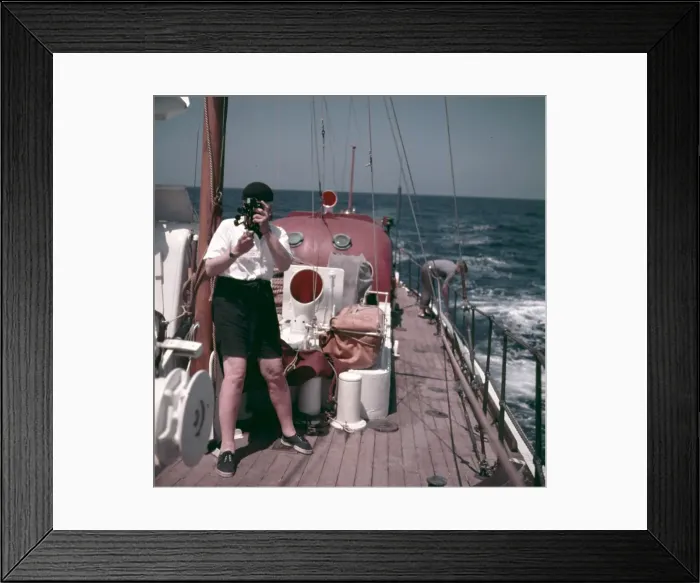 Framed Print : Lifeboat. A crewman taking a navigational reading Framed Print : Lifeboat. A crewman taking a navigational reading