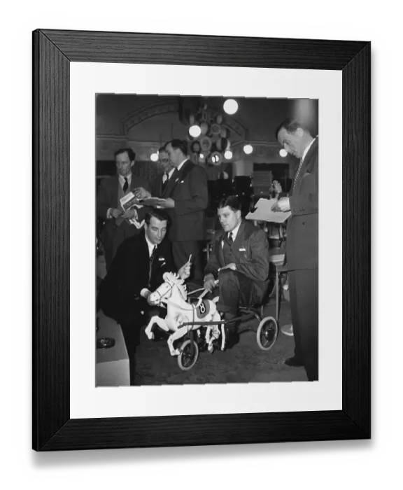 Framed Print : Man Sits On Toy Framed Print : Man Sits On Toy