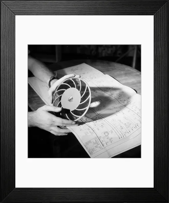 Framed Print : Filter. 13th March 1954: A close-up of a technician holding up a filter Framed Print : Filter. 13th March 1954: A close-up of a technician holding up a filter