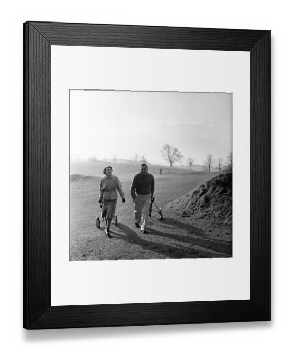 Framed Print : Golfing Couple Framed Print : Golfing Couple