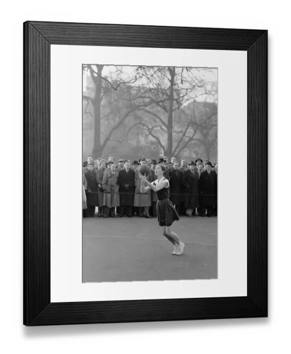 Framed Print : Netball. 2nd January 1954: The crowd watches in anticipation as a netball Framed Print : Netball. 2nd January 1954: The crowd watches in anticipation as a netball