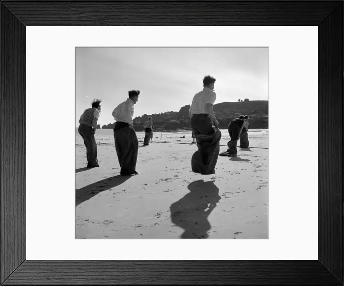 Framed Print : Sack Race. 25th April 1953: Newly wed couples honeymooning in Jersey enjoy Framed Print : Sack Race. 25th April 1953: Newly wed couples honeymooning in Jersey enjoy