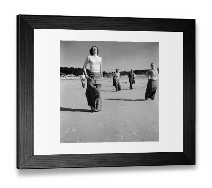 Framed Print : Sack Race. 25th April 1953: Newly wed couples honeymooning in Jersey enjoy Framed Print : Sack Race. 25th April 1953: Newly wed couples honeymooning in Jersey enjoy