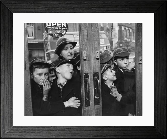 Framed Print : Let Us In. April 1953: A group of children queuing outside a sweet shop Framed Print : Let Us In. April 1953: A group of children queuing outside a sweet shop